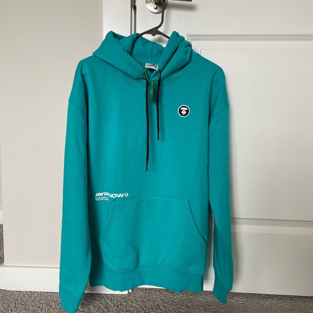 BRAND NEW WITH TAGS TEAL AAPE HOODIE. SIZE MENS MEDIUM